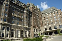 06 Banff Springs Hotel From Courtyard With A Statue Of An RCMP Riding A Horse.jpg